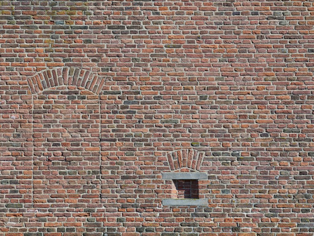 Voormalig raam in muur van bakstenen