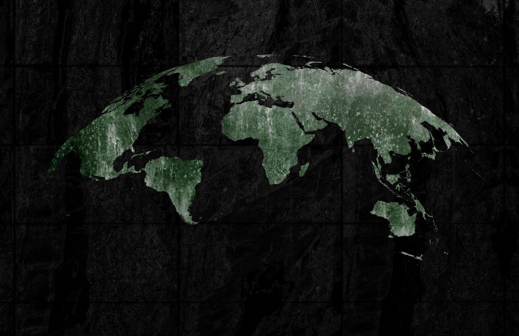 Groene wereldkaart op beton