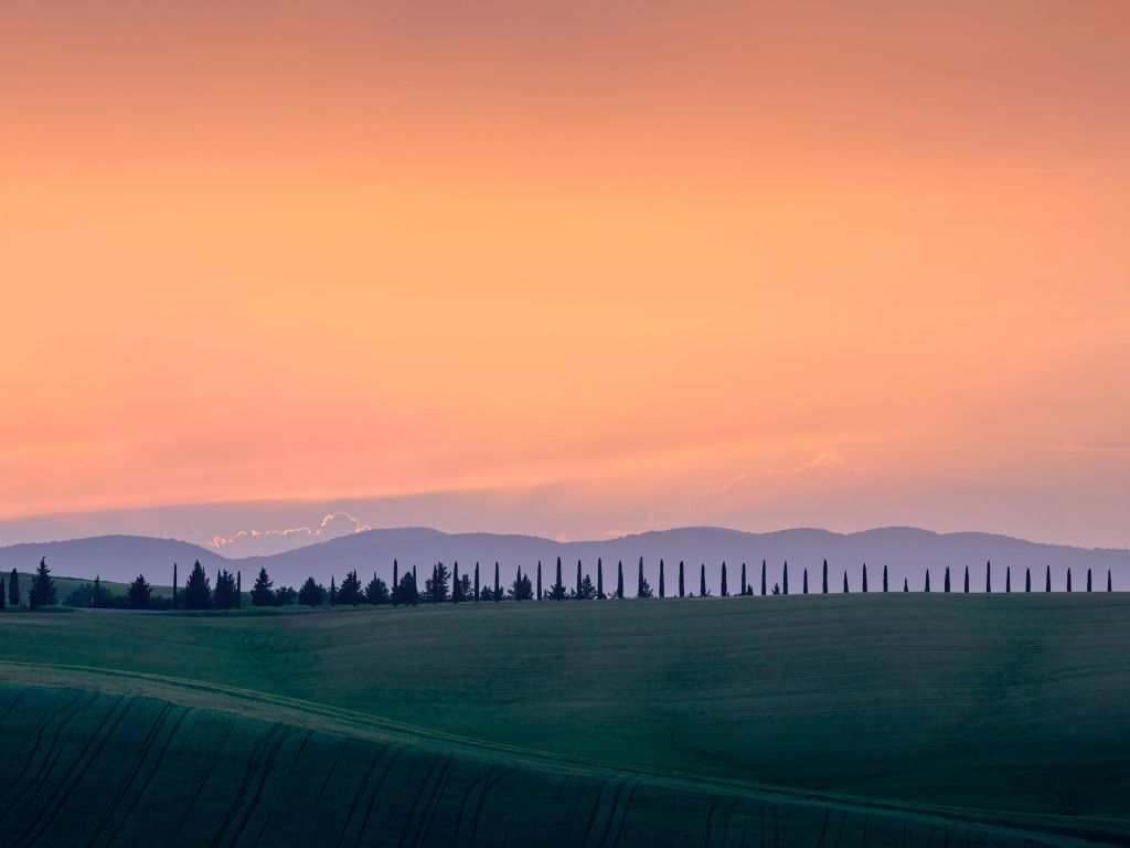Italiaans landschap met oranje lucht