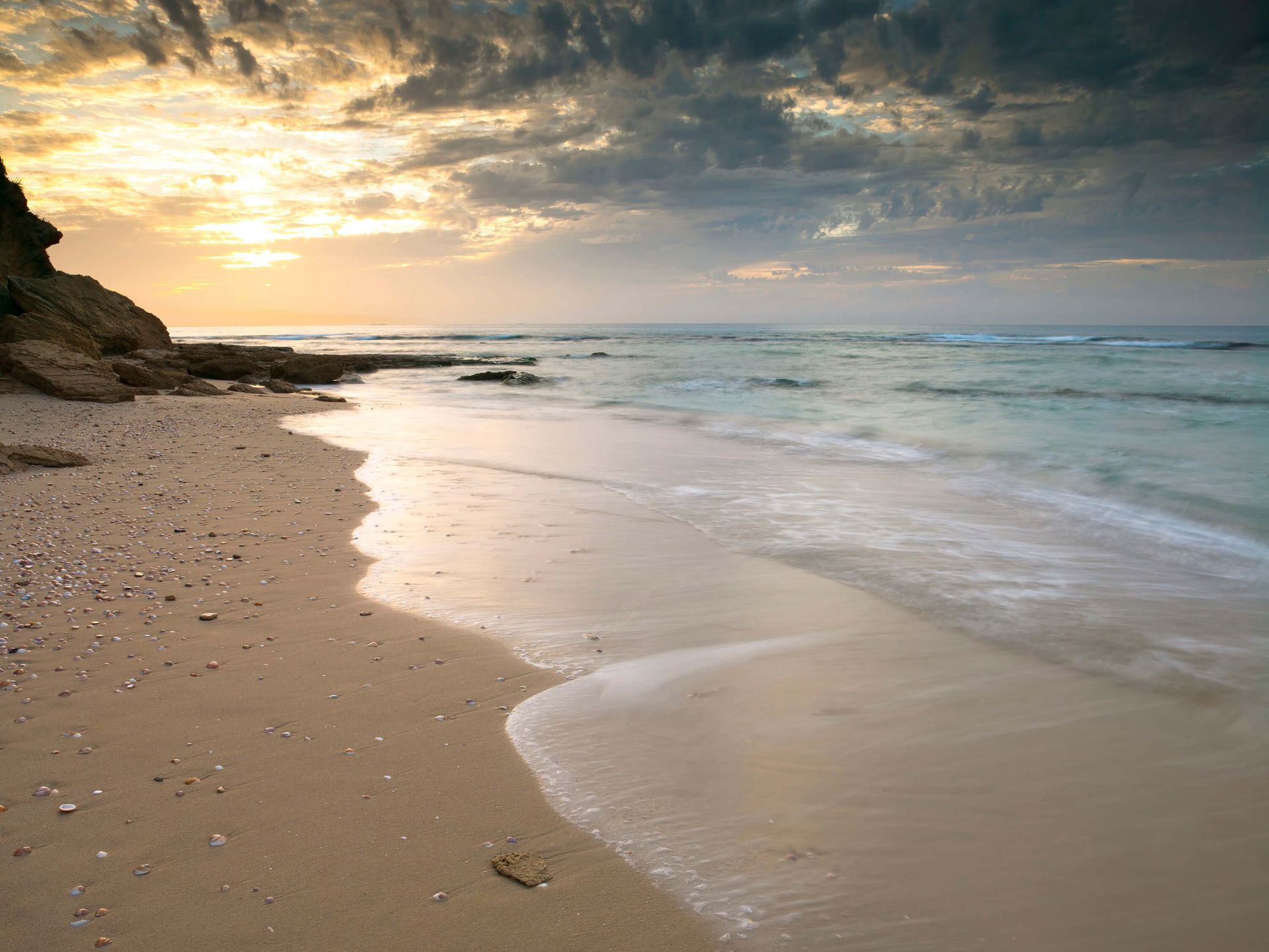 Zonsondergang op het strand main product photo