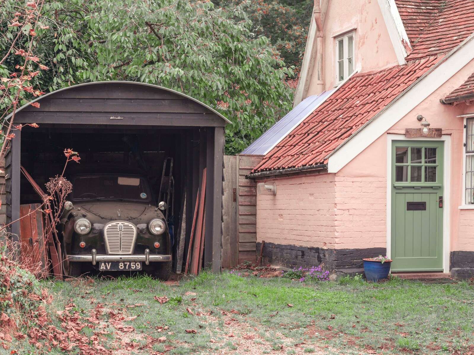 Classic car in garage of old house